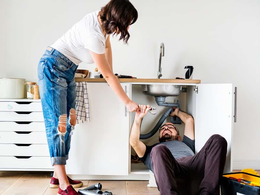 Homeowners trying to fix kitchen sink before calling Kenec Plumbing & Gas